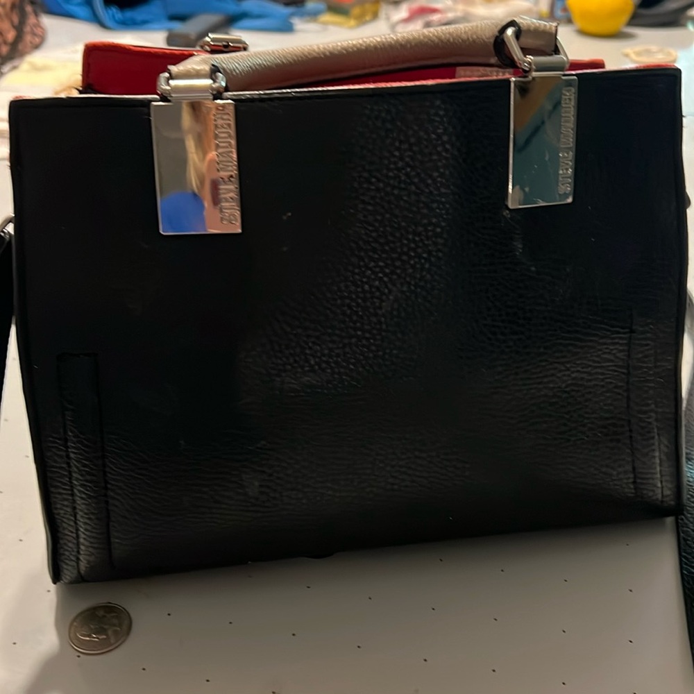 Steve Madden black purse with a handles and shoulder strap. Slightly used.